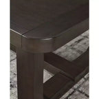 Table basse rectangulaire moderne Breckington Signature Design by Ashley avec bord en bois massif, brun foncé
